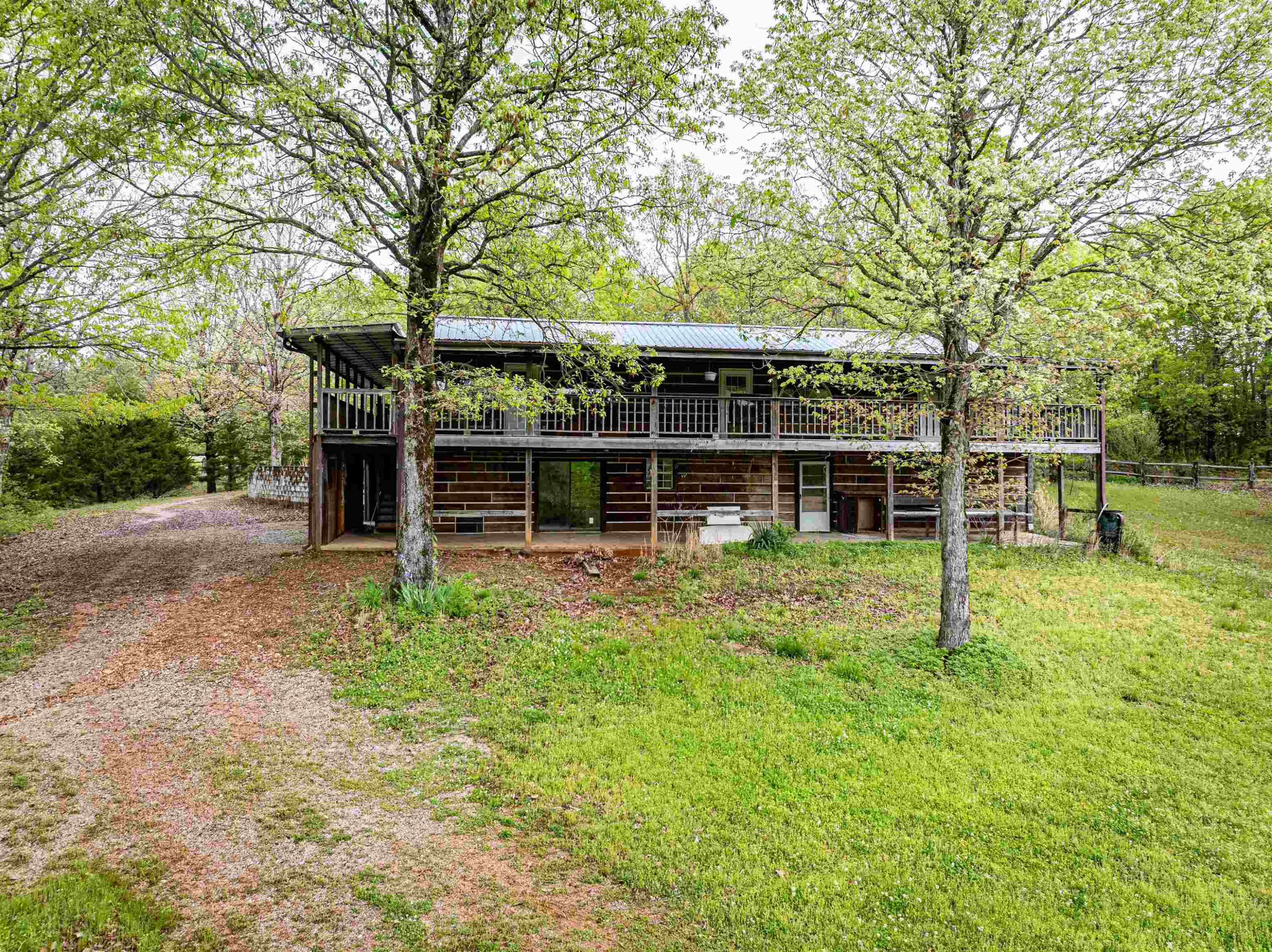 800 Bob's Landing Road Bath Springs, TN 38311 - Photo 9 of 48 a backyard of a house with table and chairs
