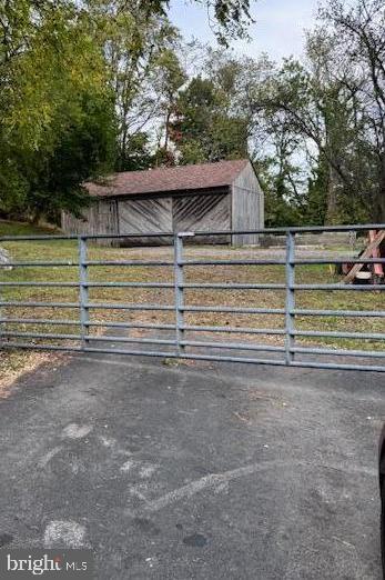 1050 Pike Springs Road, Unit BARN Phoenixville, PA 19460 - Photo 2 of 7 a view of backyard with wooden fence and large trees