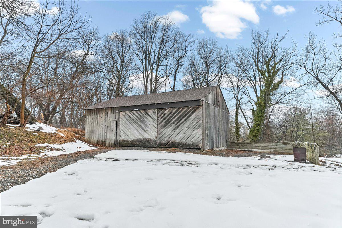 1050 Pike Springs Road, Unit BARN Phoenixville, PA 19460 - Photo 8 of 8 a view of snow on the side of a road