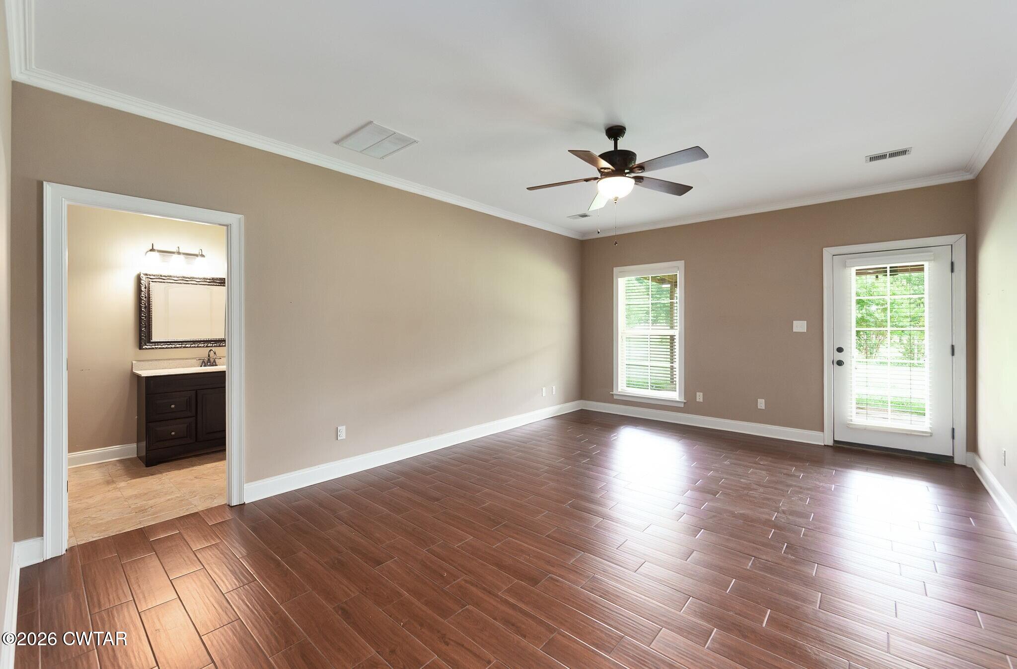 4080 Beech Bluff Road Beech Bluff, TN 38313 - Photo 27 of 41 a view of an empty room with window and wooden floor