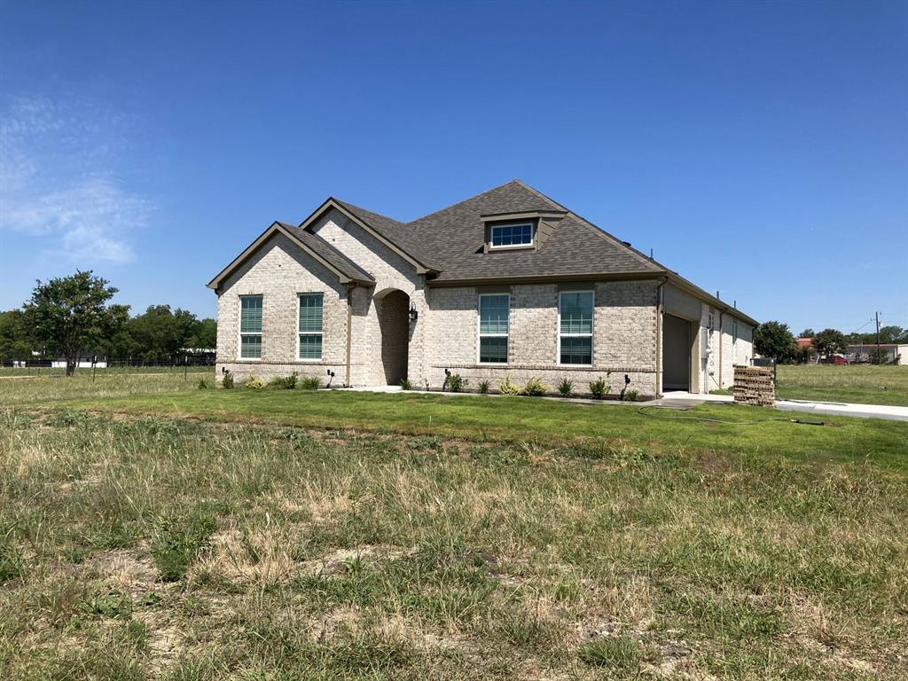 14024 South State Highway Leonard, TX 75452 - Photo 1 of 1 a front view of a house with a yard