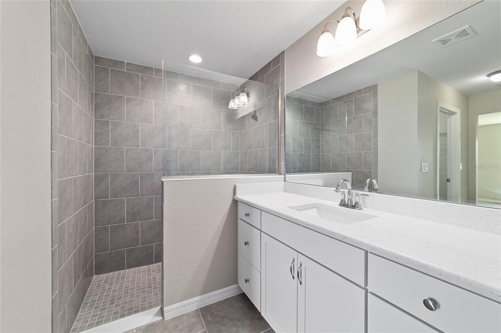 17604 Southwest 112th Lane Dunnellon, FL 34432 - Photo 9 of 23 a bathroom with a sink and a mirror