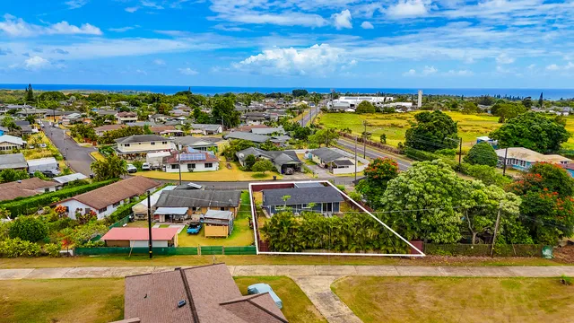 an aerial view of a house with a swimming pool yard and outdoor seating
