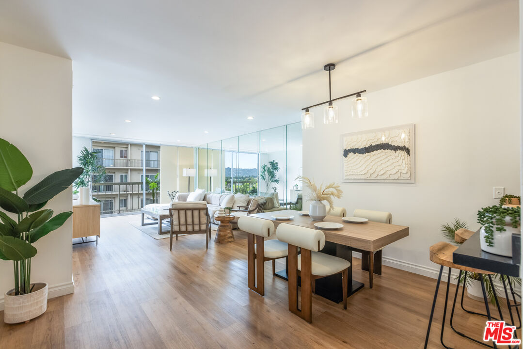 10751 Wilshire Boulevard, Unit 1106 Los Angeles, CA 90024 - Photo 1 of 10 a living room with furniture and wooden floor