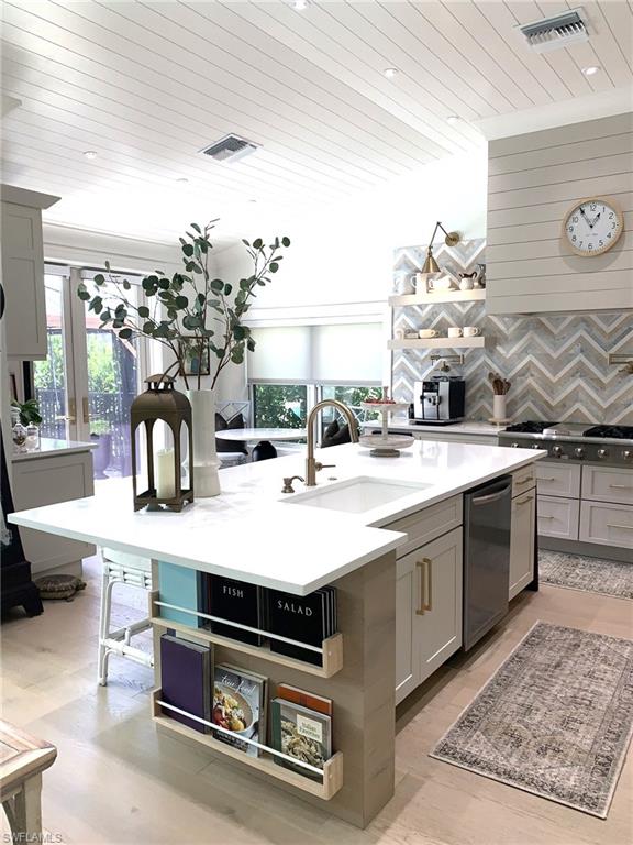 a view of kitchen sink and stove