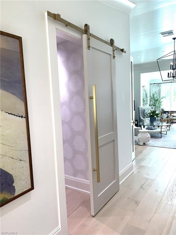 1344 Monarch Circle Naples, FL 34116 - Photo 12 of 33 a view of a bathroom with mirror