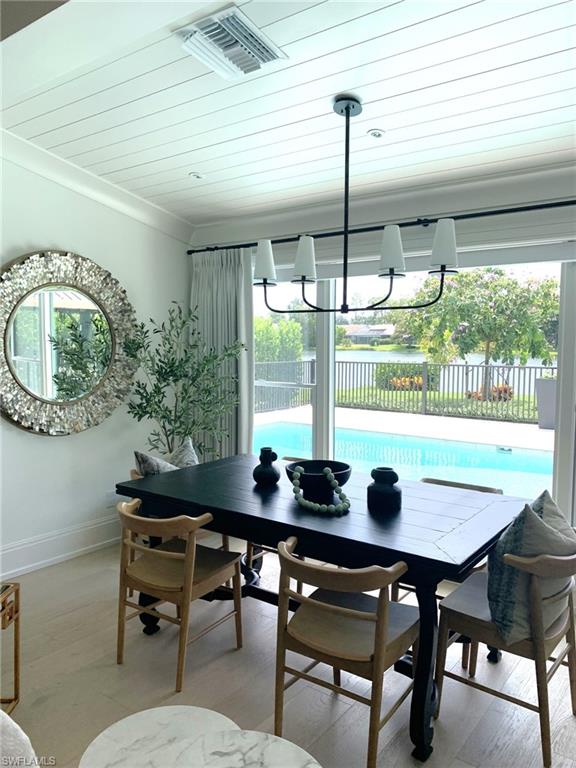 1344 Monarch Circle Naples, FL 34116 - Photo 15 of 33 a view of a dining room with furniture window and outside view