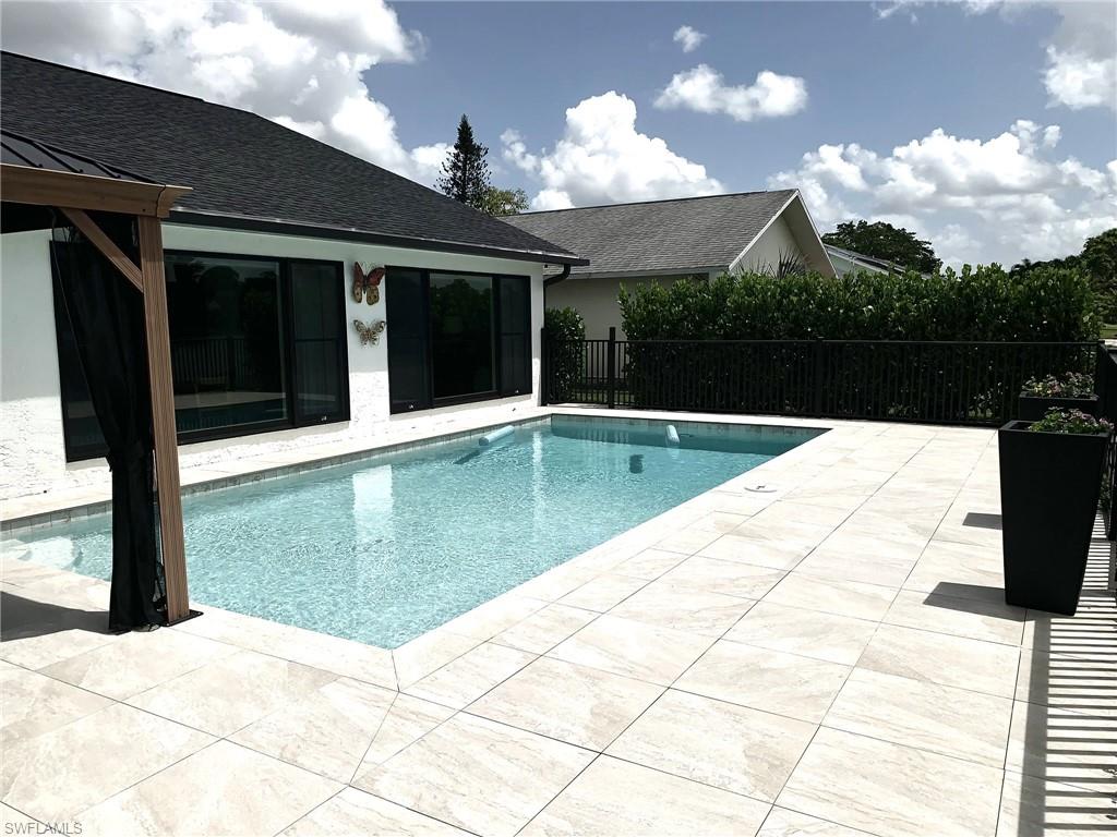 1344 Monarch Circle Naples, FL 34116 - Photo 18 of 33 a view of swimming pool with a patio