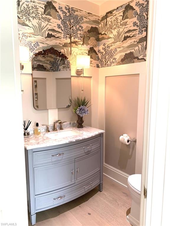 1344 Monarch Circle Naples, FL 34116 - Photo 21 of 33 a bathroom with a sink and mirror