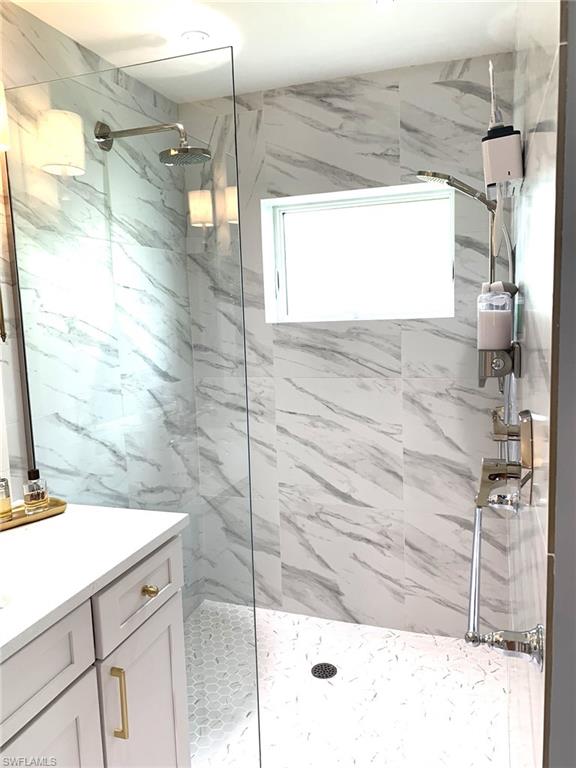 1344 Monarch Circle Naples, FL 34116 - Photo 27 of 33 a bathroom with a shower and a sink