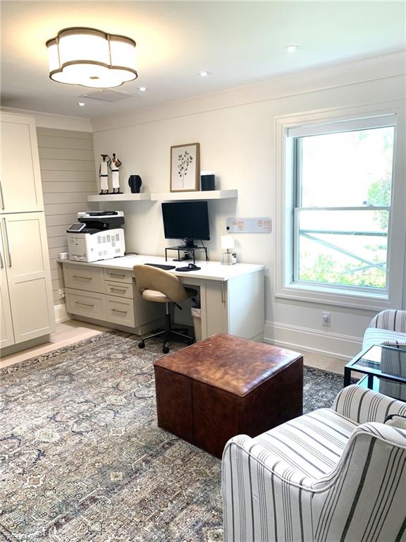 1344 Monarch Circle Naples, FL 34116 - Photo 3 of 33 a large living room with a couch and a window