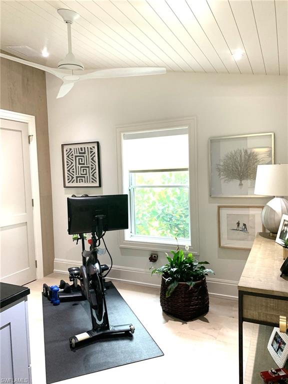 1344 Monarch Circle Naples, FL 34116 - Photo 5 of 33 a room with furniture and a window