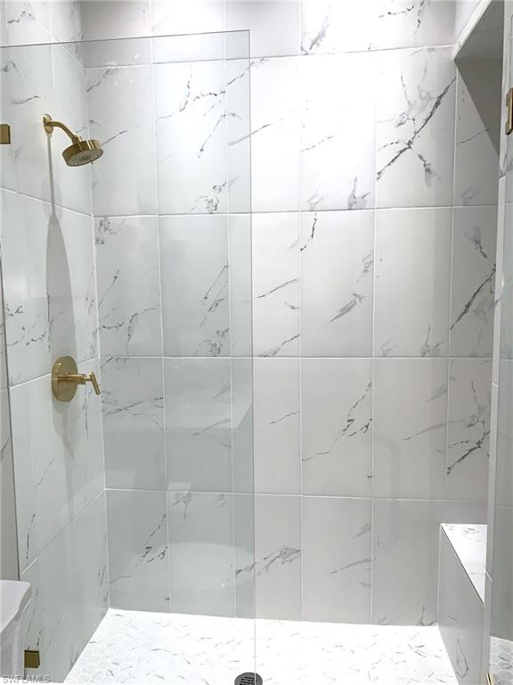 1344 Monarch Circle Naples, FL 34116 - Photo 8 of 33 a bathroom with a shower