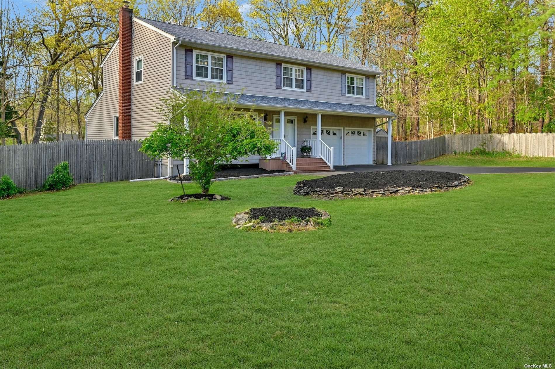 29 Kastal Drive Ridge, NY 11961 - Photo 1 of 1 a view of an house with backyard and a tree