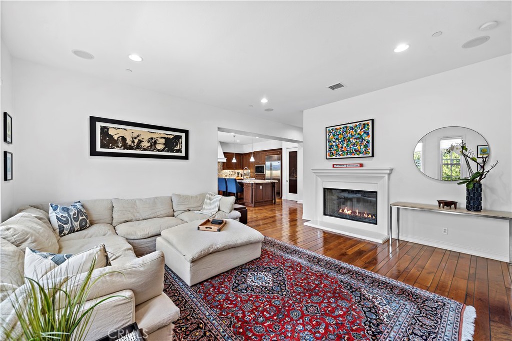 11 Pisano Street Ladera Ranch, CA 92694 - Photo 19 of 47 a living room with furniture and a fireplace
