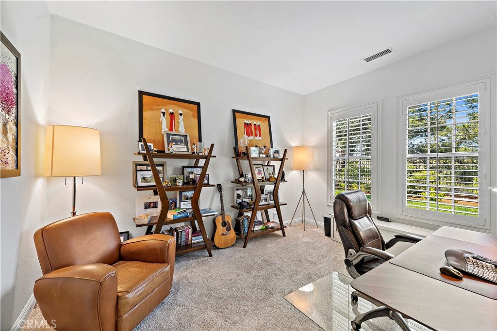 11 Pisano Street Ladera Ranch, CA 92694 - Photo 21 of 47 a livingroom with workspace and a couch