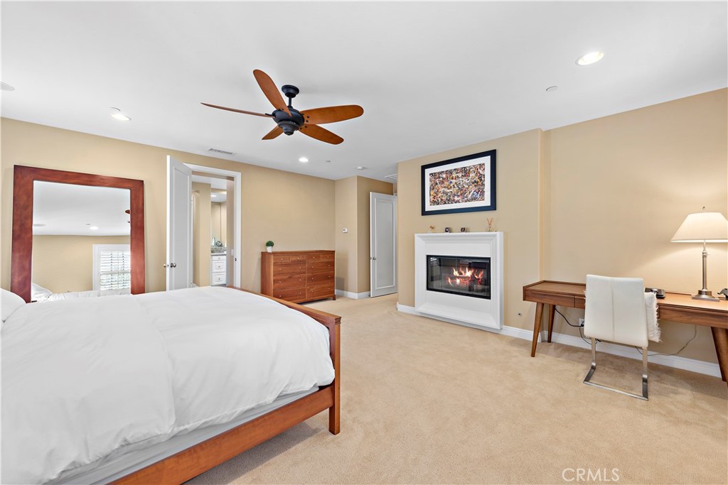 11 Pisano Street Ladera Ranch, CA 92694 - Photo 23 of 47 a spacious bedroom with a bed and a chair