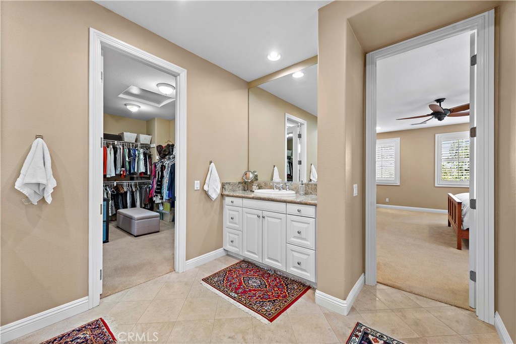 11 Pisano Street Ladera Ranch, CA 92694 - Photo 25 of 47 a room with a walk in closet and a chair