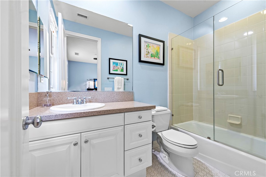 11 Pisano Street Ladera Ranch, CA 92694 - Photo 32 of 47 a bathroom with a sink a toilet and shower