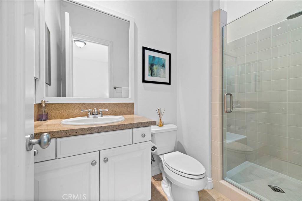 11 Pisano Street Ladera Ranch, CA 92694 - Photo 34 of 47 a bathroom with a sink toilet and a mirror
