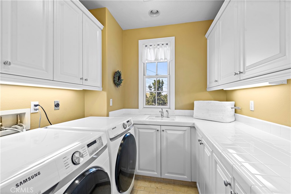 11 Pisano Street Ladera Ranch, CA 92694 - Photo 36 of 47 a utility room with dryer and washer
