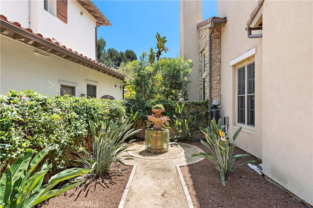 11 Pisano Street Ladera Ranch, CA 92694 - Photo 38 of 47 a vase of flowers sitting on a floor