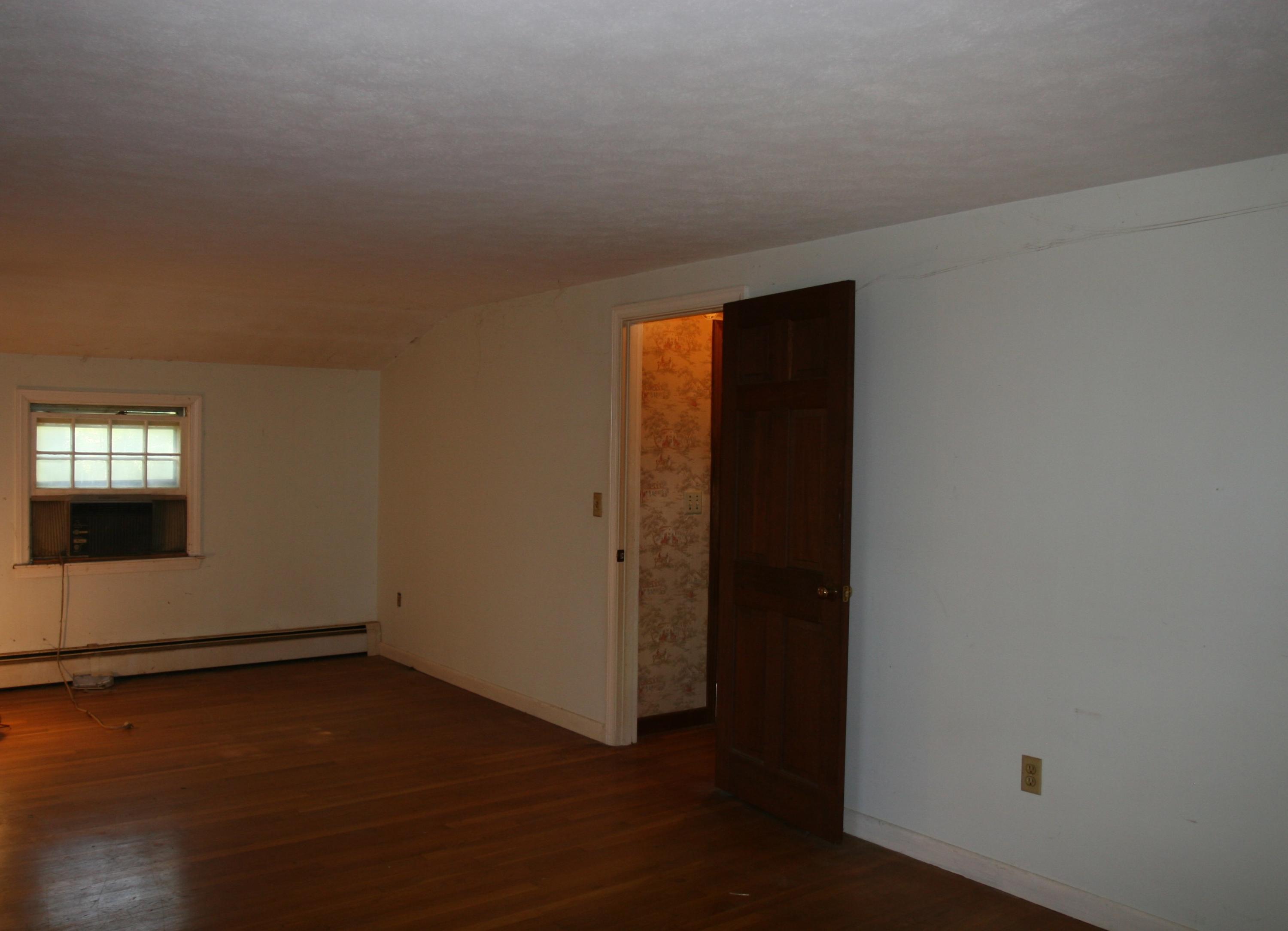 117 Turtleback Road Marstons Mills, MA 02648 - Photo 21 of 35 an empty room with wooden floor and windows