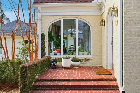 a view of a livingroom with furniture and a window
