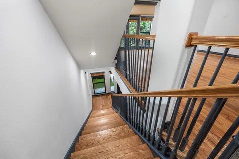 a view of entryway and hall with wooden floor