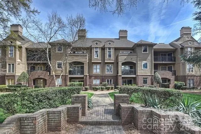 a front view of a building with garden