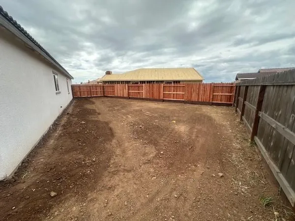a view of a terrace with lawn chairs
