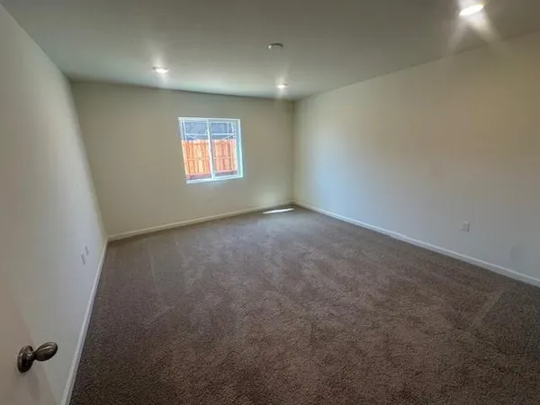 a bathroom with a sink a toilet a mirror and shower