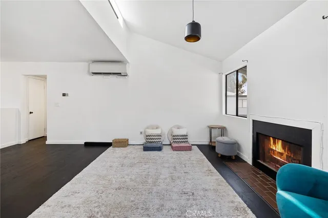 a spacious bedroom with a bed and a window