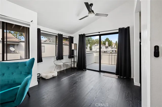 a kitchen with stainless steel appliances granite countertop white cabinets and a stove