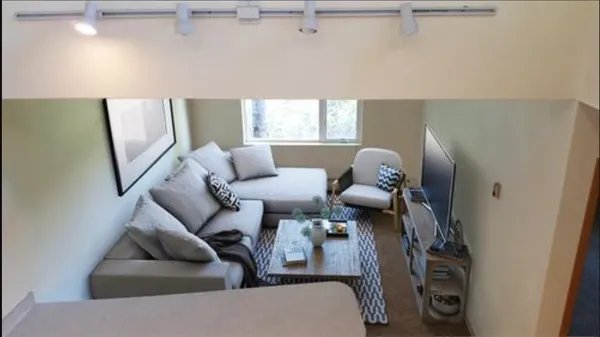 a living room with furniture and a window