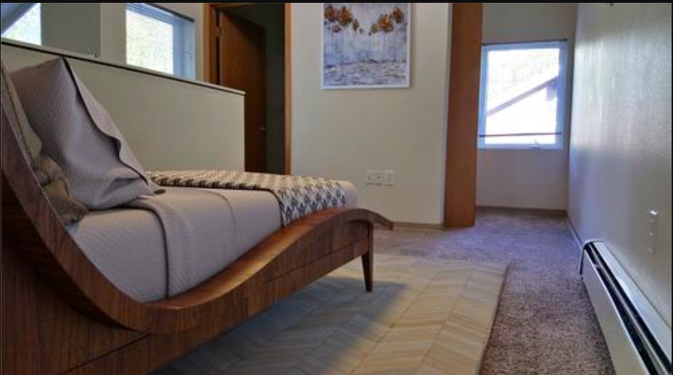 353 Hightower Road Other, AK 99587 - Photo 9 of 11 a bedroom with a bed and a window