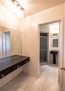 a room with wooden floors and white walls