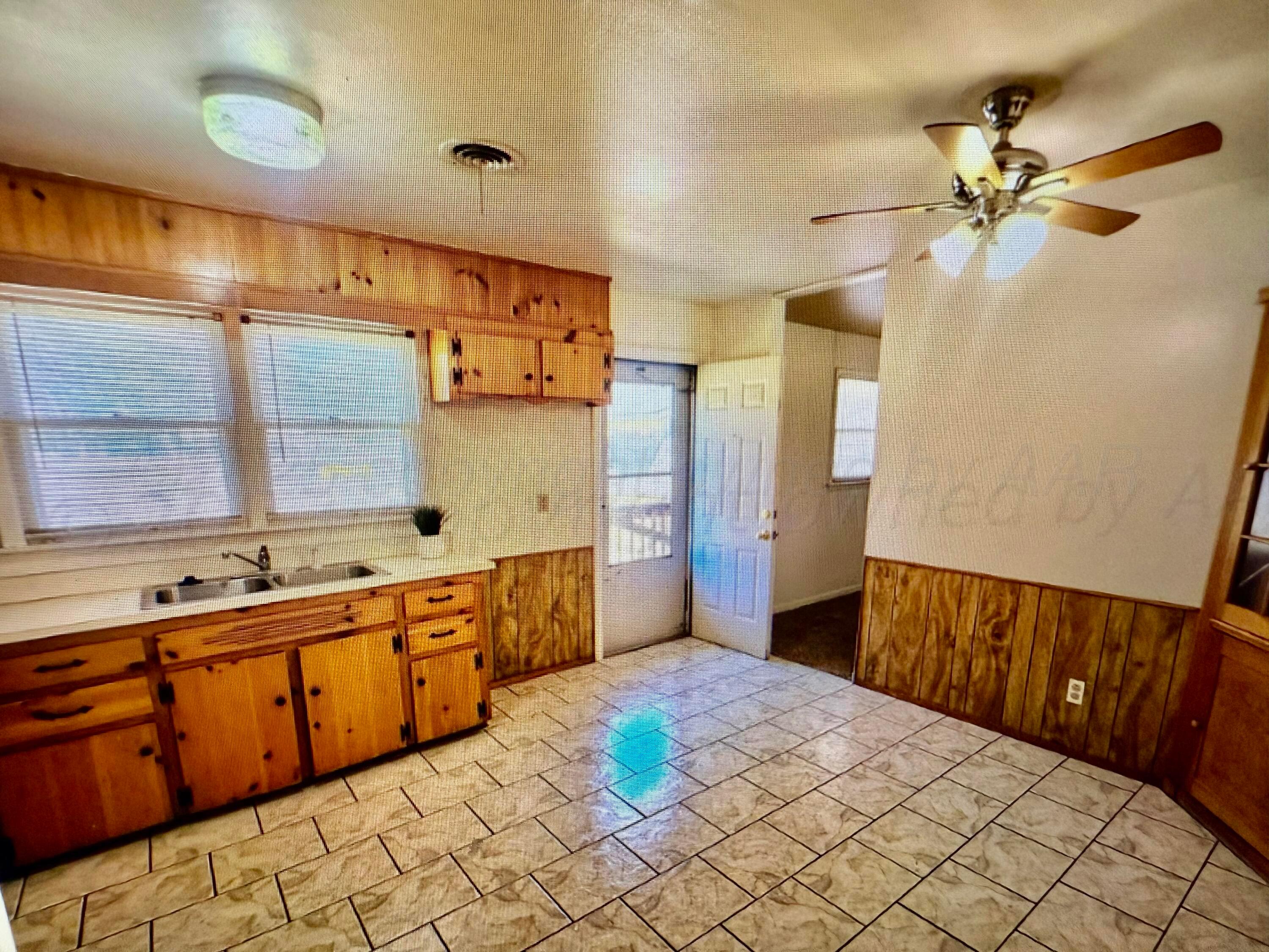 4612 South Lamar Street Amarillo, TX 79110 - Photo 2 of 8 a spacious bathroom with a mirror sink and bathtub