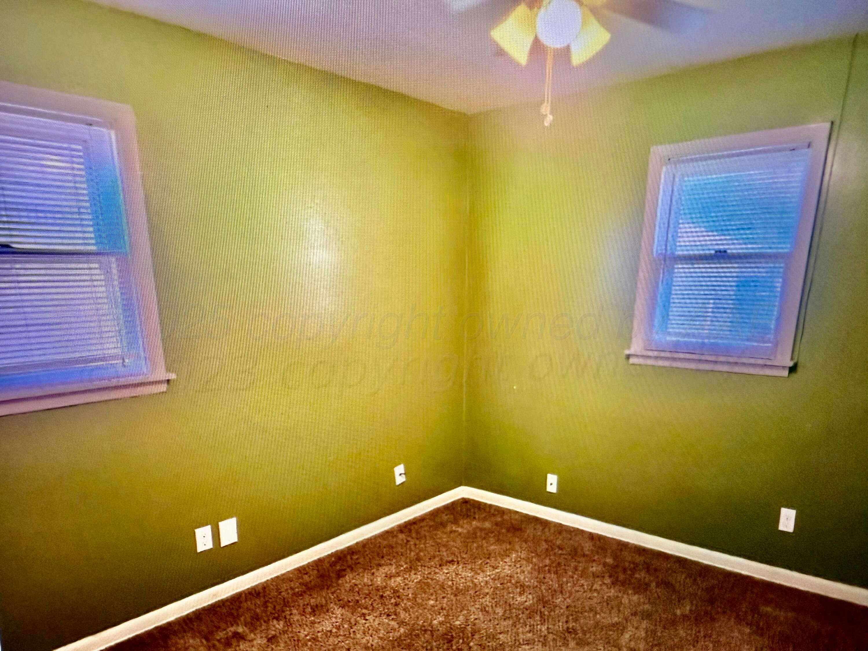 4612 South Lamar Street Amarillo, TX 79110 - Photo 5 of 8 a view of a small space with a swimming pool and chandelier fan