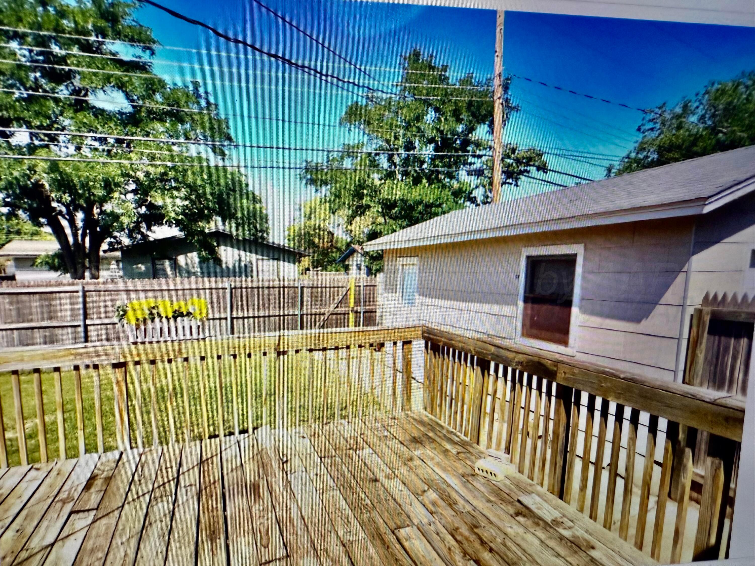 4612 South Lamar Street Amarillo, TX 79110 - Photo 8 of 8 a view of balcony with wooden floor and outdoor space