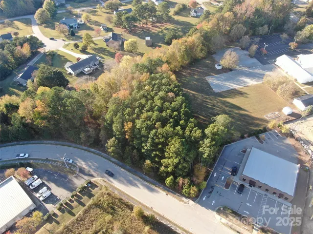 a aerial view of a house with a yard