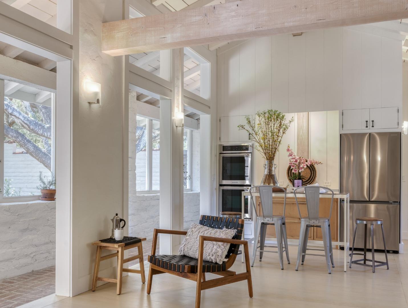 150 Littlefield Road Monterey, CA 93940 - Photo 26 of 51 a kitchen with stainless steel appliances refrigerator dining table and chairs