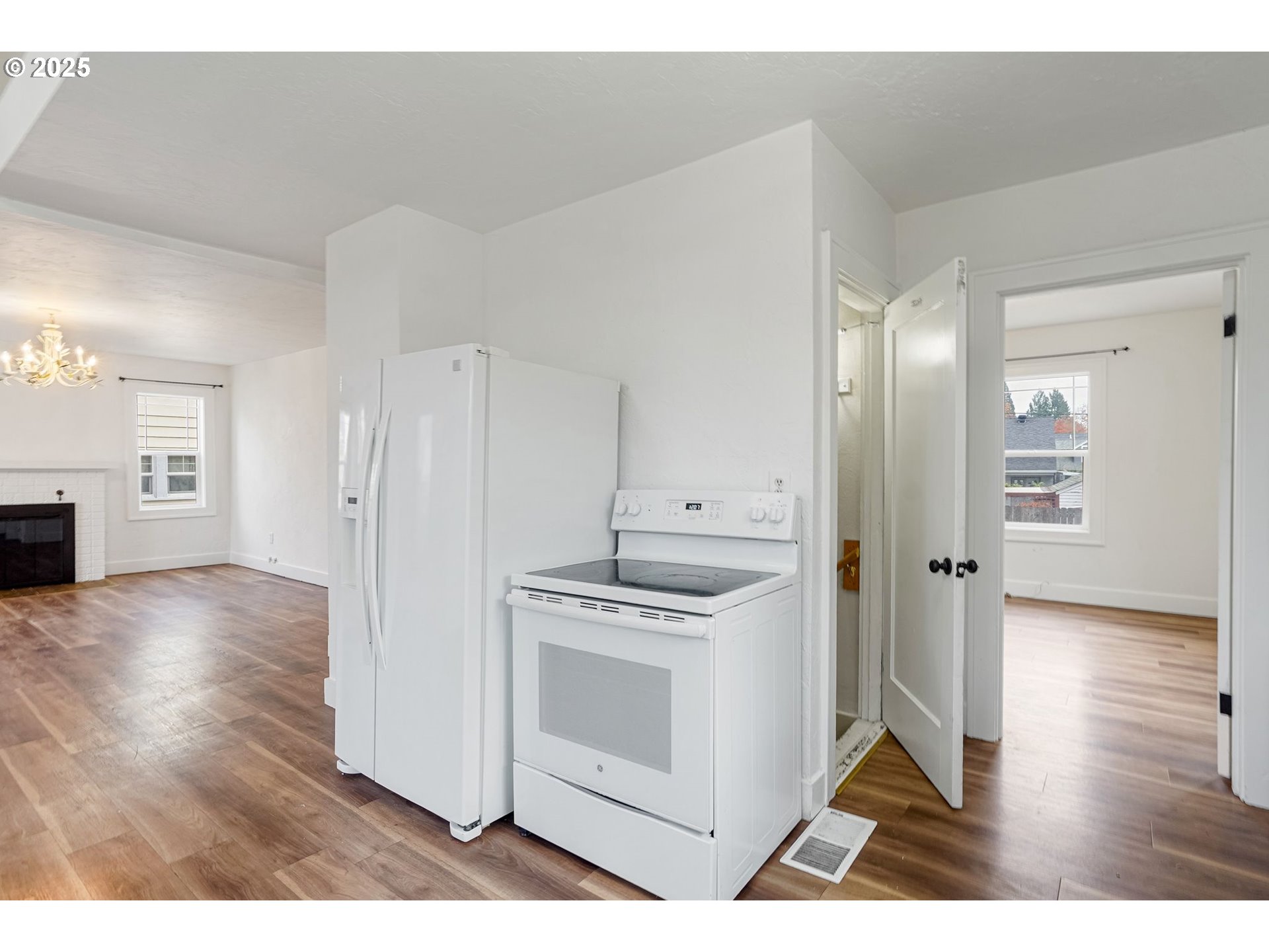 562 21st Street Northeast Salem, OR 97301 - Photo 14 of 45 a kitchen with a refrigerator and a wooden floor