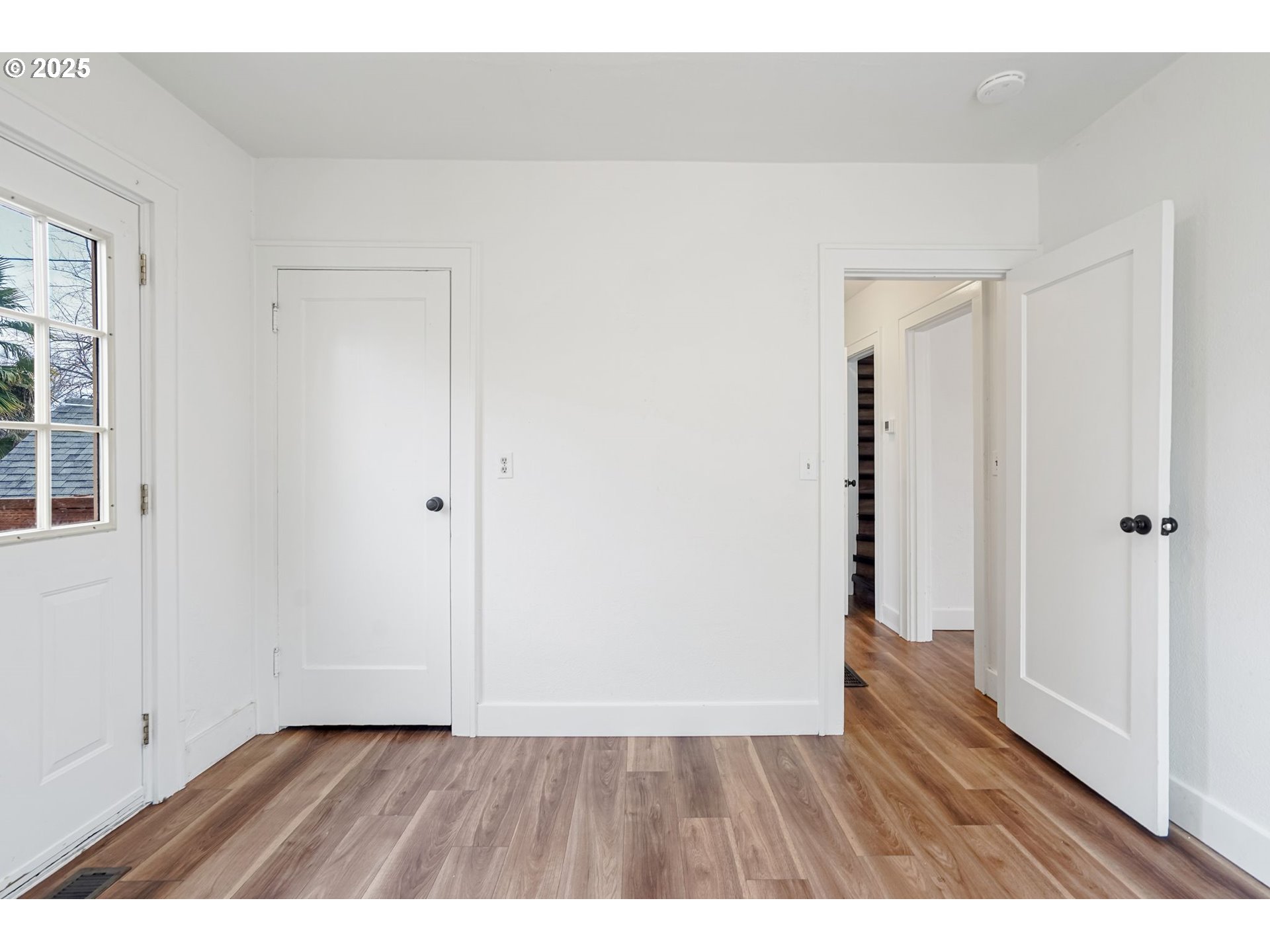 562 21st Street Northeast Salem, OR 97301 - Photo 23 of 45 a view of an empty room with wooden floor