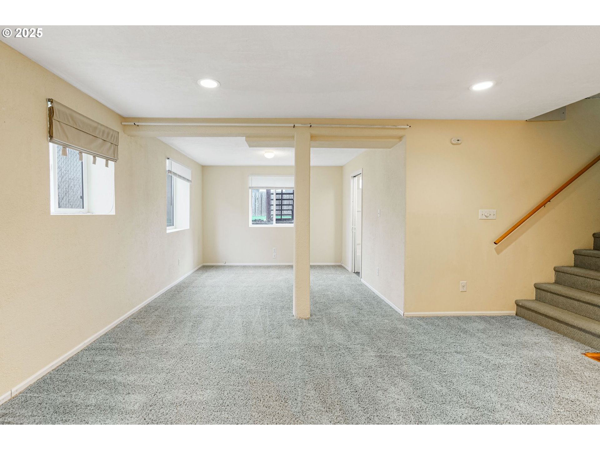562 21st Street Northeast Salem, OR 97301 - Photo 31 of 45 a view of an empty room with wooden floor and stairs