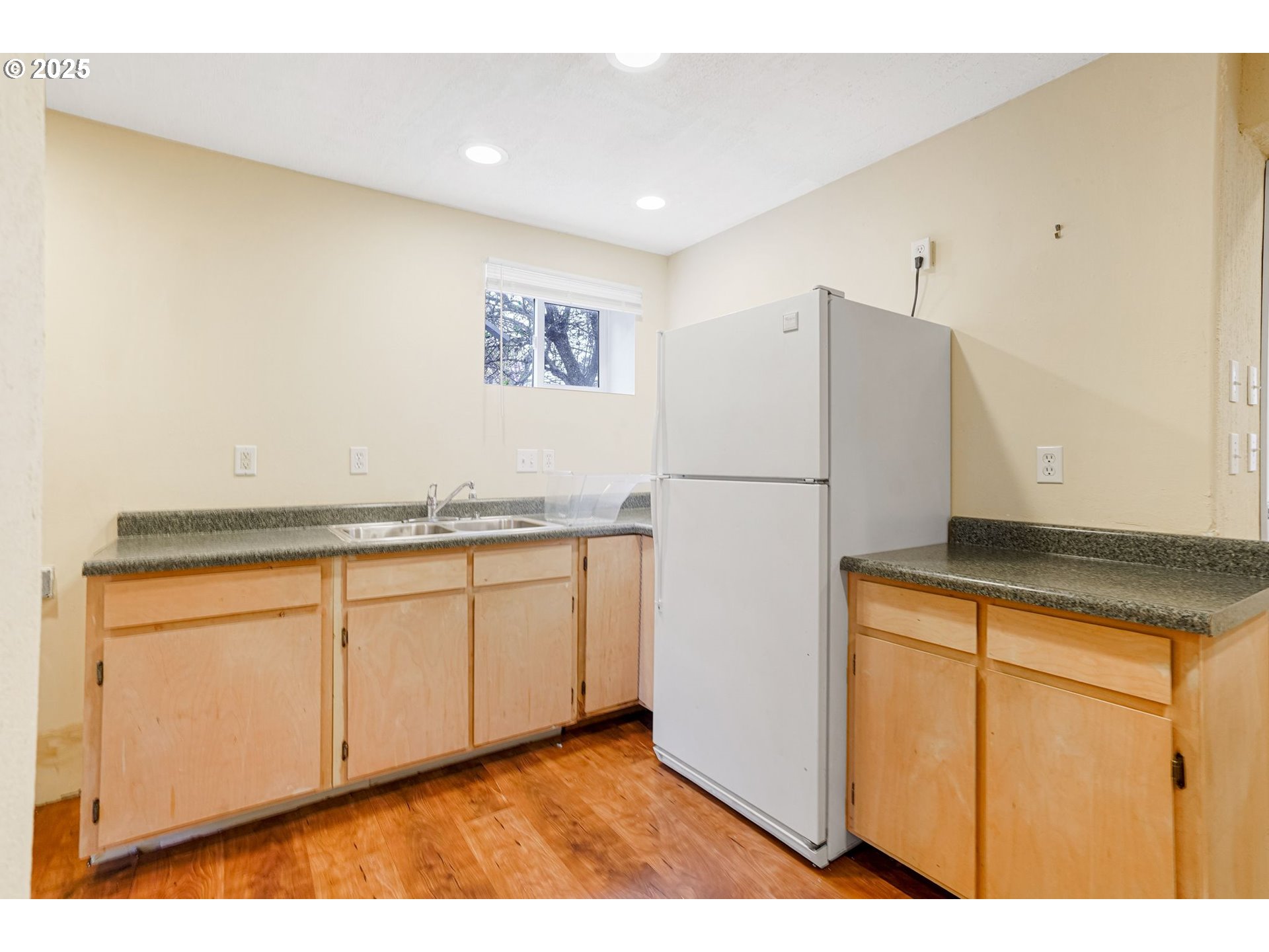 562 21st Street Northeast Salem, OR 97301 - Photo 36 of 45 a kitchen with granite countertop cabinets and refrigerator