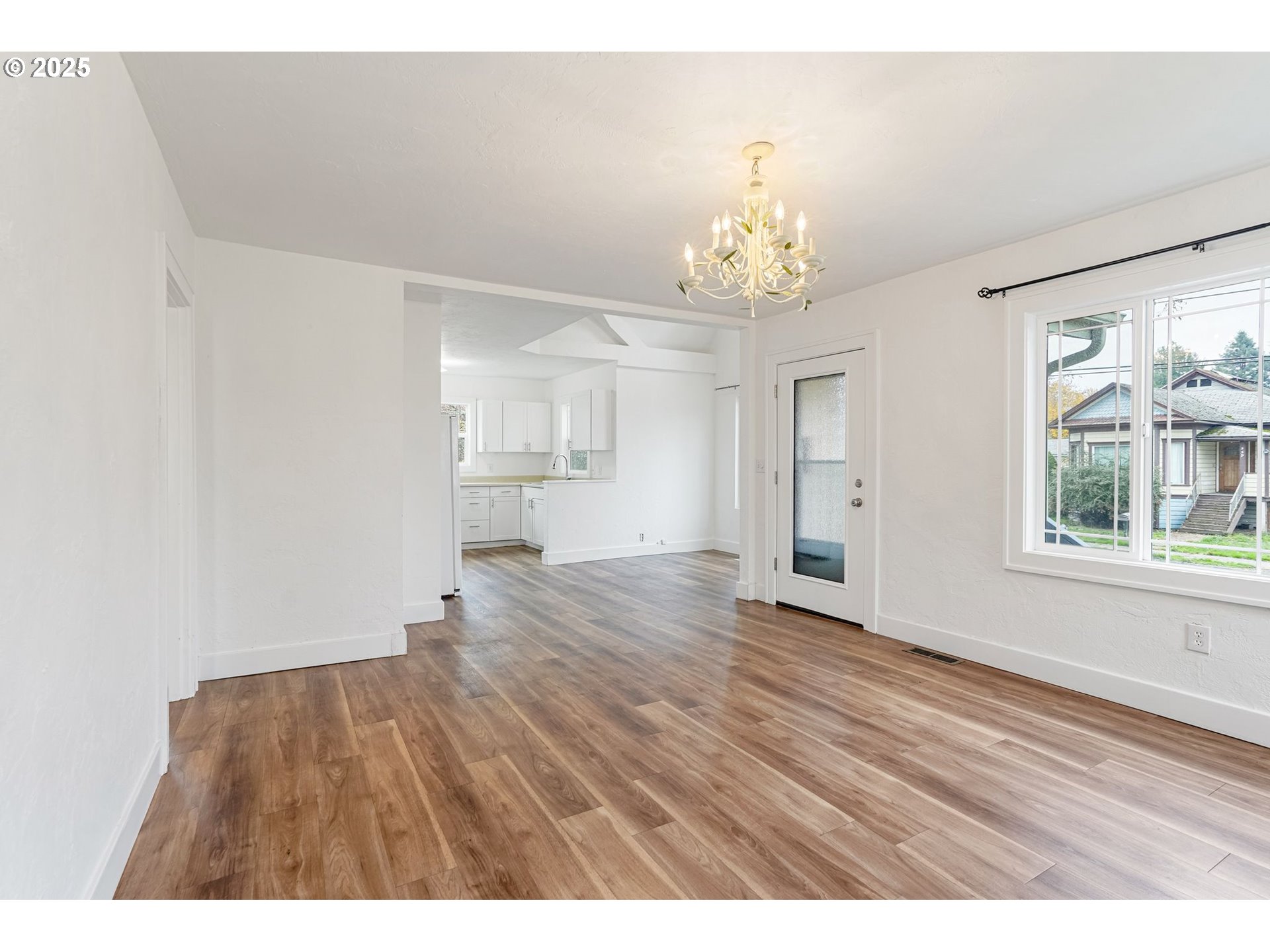 562 21st Street Northeast Salem, OR 97301 - Photo 8 of 45 a view of an empty room with wooden floor and a window