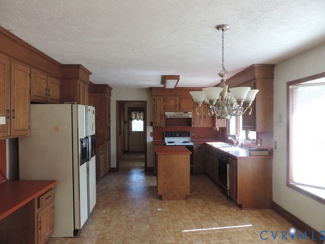 102 Hicks Lane Rice, VA 23966 - Photo 8 of 26 a kitchen with stainless steel appliances granite countertop a stove a refrigerator a sink dishwasher and a wooden cabinets