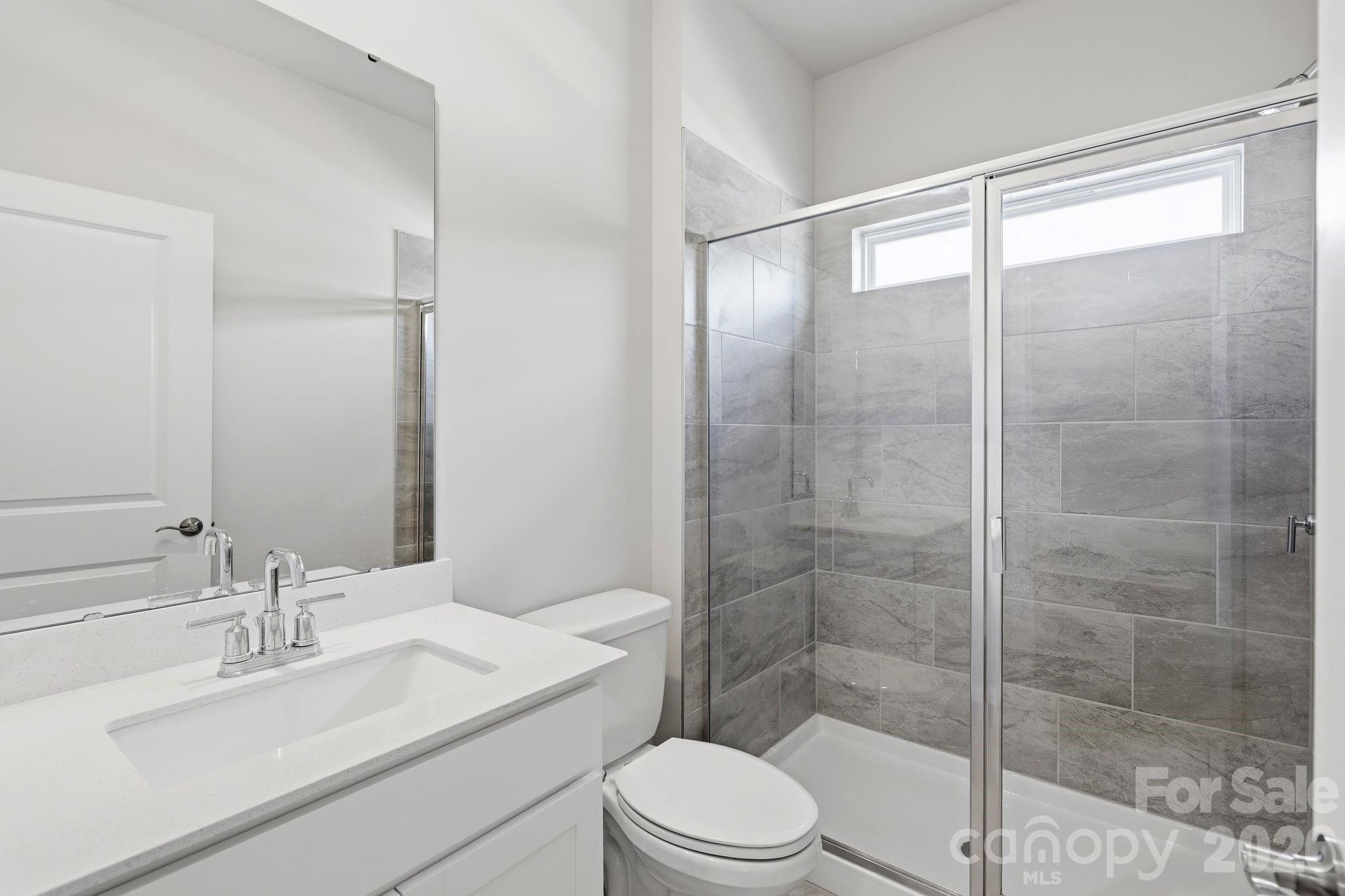 5475 Redbud Road, Unit 57 Lancaster, SC 29720 - Photo 24 of 30 a bathroom with a sink toilet and shower