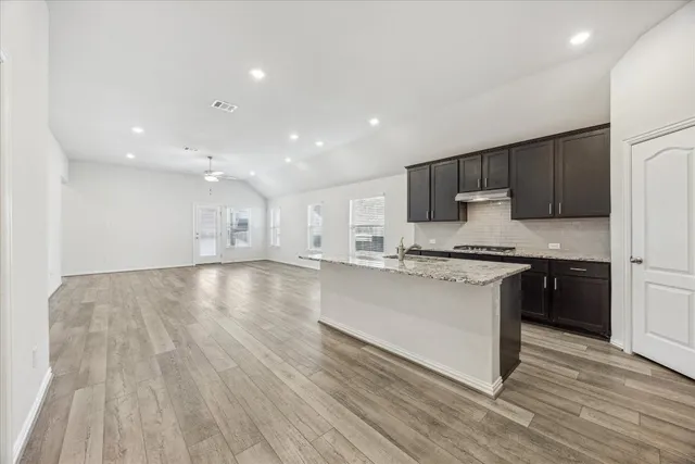 a view of a house with a yard and porch